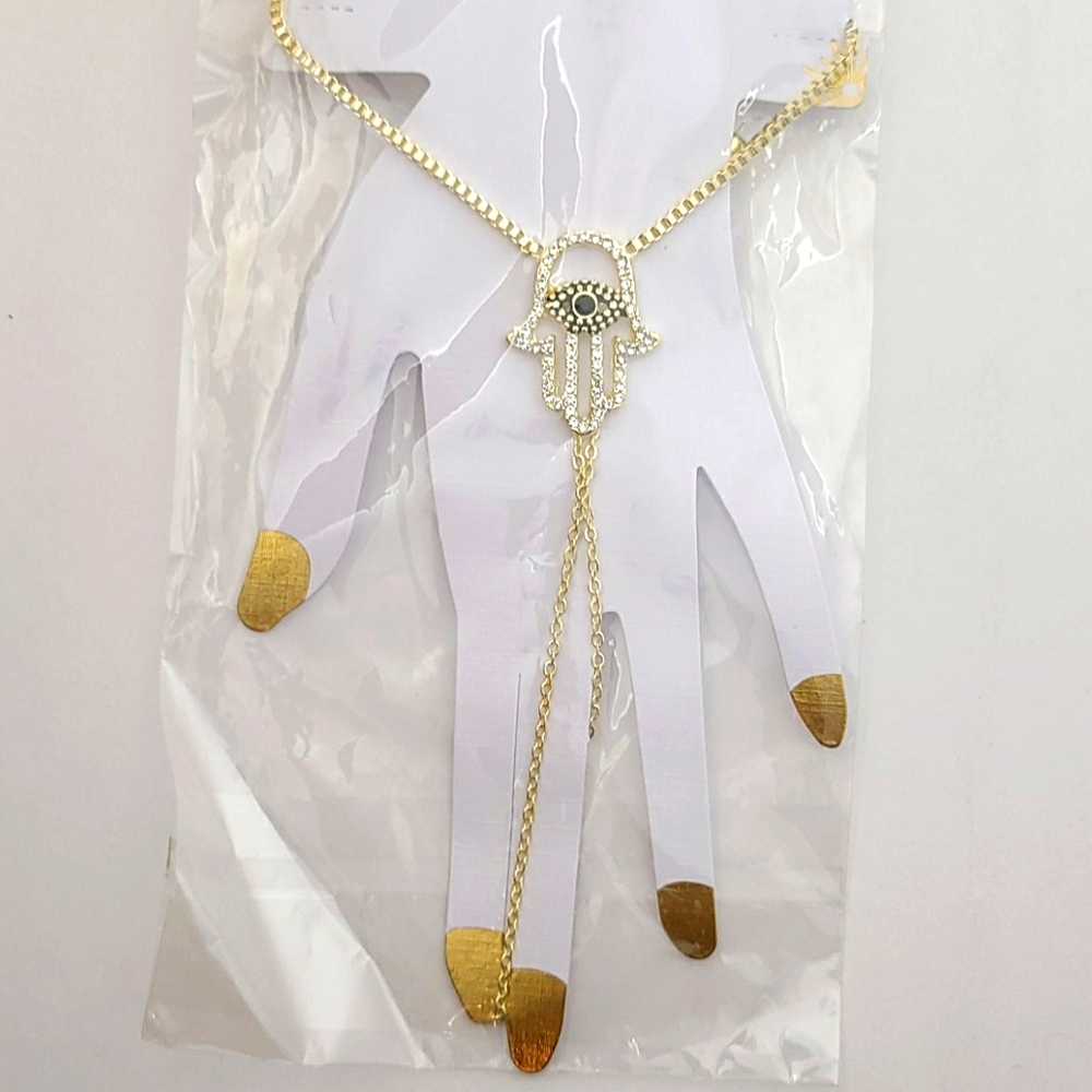 Gold colored finger bracelet